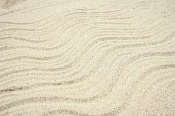 Fototapeta na wymiar stylish beautiful pattern on the sand of the sea in the summer on the nature