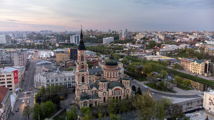 Fototapeta na wymiar Holy Annunciation Cathedral aerial view with evening sunset scenic cloudscape. Kharkiv city orthodox church in downtown, Ukraine