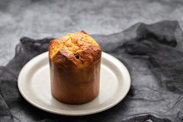 Delicious Panettone slice with candied fruits on dish