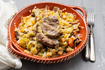 Traditional chickpeas dish in casserole in brown dish