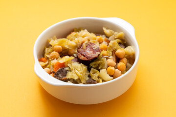 Traditional chickpeas dish in casserole in white bowl