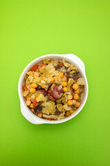 Traditional chickpeas dish in casserole in white bowl