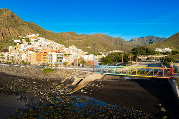 Obraz premium Aerial view above rainbow colored swimming beach - Playa de Las Teresitas - in San Andres Tenerife Canary Islands