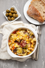 Traditional chickpeas dish in casserole in white bowl