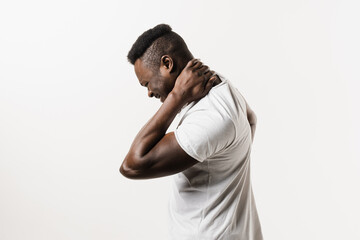 Cervical spine osteochondrosis is radicular syndromes of african american man. African man feel spine pain because of spinal nerves compression on white background.