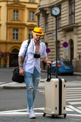 Man with luggage for vacation, trip. Man tourist with travel bag. Man with luggage being ready to travel on his vacation.