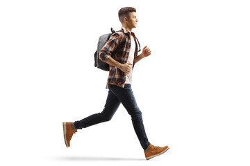 Full length profile shot of a male student running