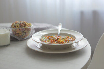Multicolored corn rings for breakfast on the table