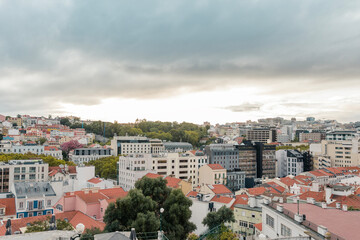 Fototapeta na wymiar Aerial panoramic view of Lisbon, Portugal. Drone photo of the Lisbon old town skyline. Historical district at sunrise in capital city of Portugal