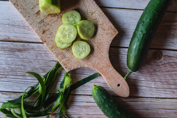 Top and side view of cut cucumber on cutting board