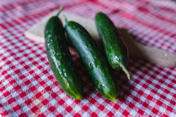 Top and side view of cut cucumber on cutting board
