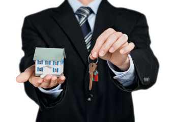Businessman Holding a Model House and Keys