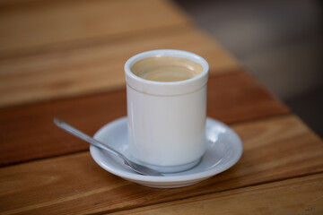 cup of coffee on wooden table