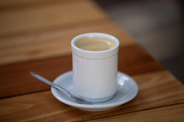 cup of coffee on wooden table