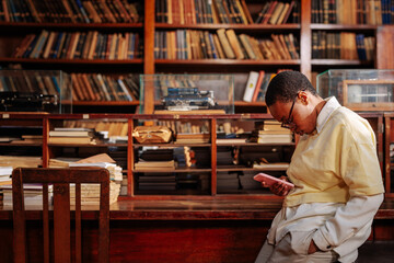University student alone in library.
