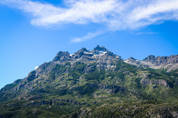beautiful landscape with pine trees and mountains and blue sun. nature and tranquility