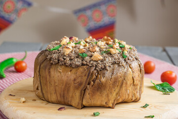 Maqluba dish. It is an Arabian dish that contains eggplant, rice and some nuts.
People also use chicken on it.
The background is ready with Ramadan  vibes and styles.