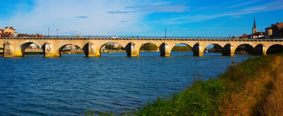 Panorama of bridge over Saona and loire river and riverside of Macon, France