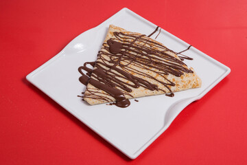 Chocolate crepe with sugar