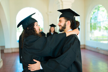 Attractive couple celebrating graduating university