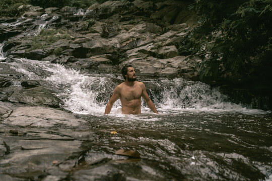 Female hands waterfall water, nature.