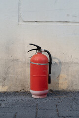 fire extinguisher on a wall. vintage fire extinguisher.