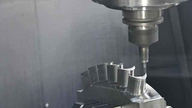 The 5-axis machining center cutting the water turbine blade part with ball end  mill tool.