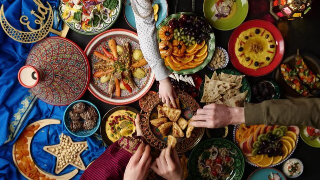 Traditional Dishes to Serve During Ramadan. Iftar meals on the table. Samosa, Traditional halal food. Muslim family breaks fast after sunset