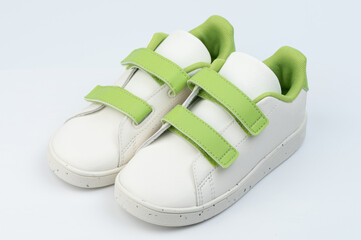 White with green velcro shoes