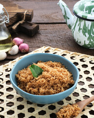 Serundeng, Indonesian spicy coconut flakes, made from grated coconut stir-fried with herbs and spices.
