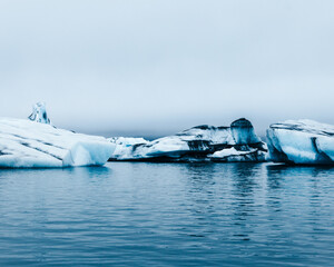 Different shaped glaciers on a lake