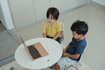 Children focused on their online classes with their teacher