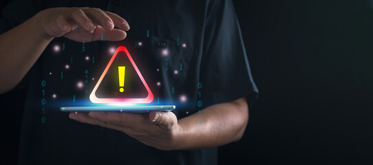 Businessman using smartphone , System warning hacked alertsign for notification error personal data hacking virus cybercrime.concept Cybersecurity vulnerability computer network.