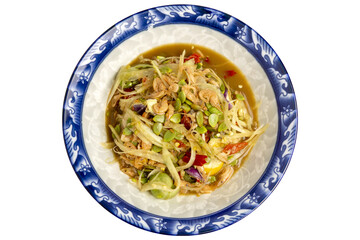 Top View of Spicy Green Papaya Salad, called Som Tam in Thai, Northeastern Thai cuisine served on vintage dish.