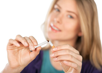 woman breaking a cigarette