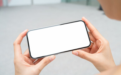 Hand holding smartphone mockup of blank screen, Take your screen to put on advertising.