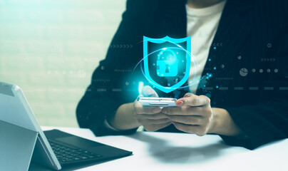 Security Smart Technology concept. Businesswoman using mobile phone connecting to lock and unlock online data. blurred background.