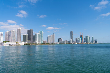 Fototapeta premium Miami, Florida USA - April 15, 2021: metropolis cityscape of city downtown with skyscrapers and sea