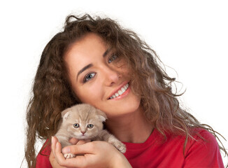 Fototapeta na wymiar Happy young woman with a small amusing kitten