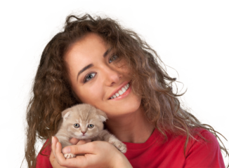 Happy young woman with a small amusing kitten