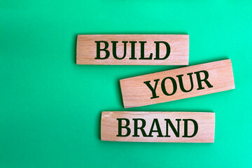 Wooden blocks with words 'Build Your Brand'.