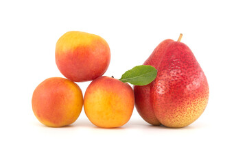 Apricots and multi-colored pear isolated on white