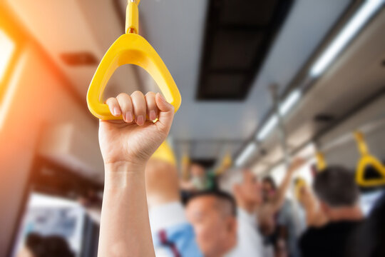 People Hand holding Handle on the train .Clipping path
