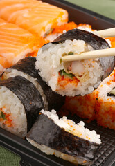 Vertical picture of the land. In the frame there are chopsticks in which there is one piece