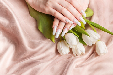 Female hand with spring nail design.