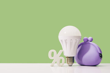 Glowing LED light bulb in lilac coin purse with percentage symbol on table. Green energy saving and...