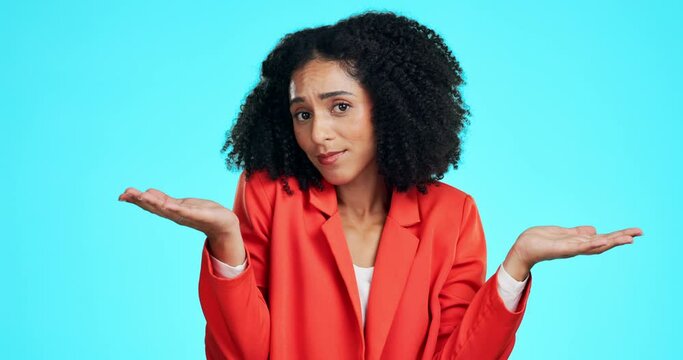 Confused, shrugging and face of woman in studio with doubt, unsure and choice on blue background. Contemplation, portrait and female with emoji hands, deciding and dont know gesture while isolated