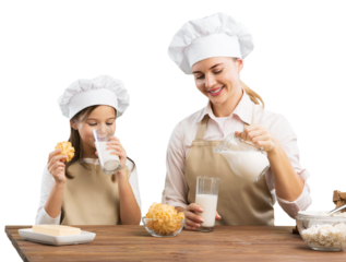The beautiful young mother and her little daughter cooking