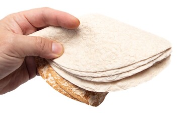 Armenian lavash in hand isolated on white background.