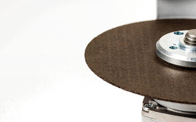 Angle grinder with reinforced cutting wheel for metal. Construction power tool, industry. Close-up